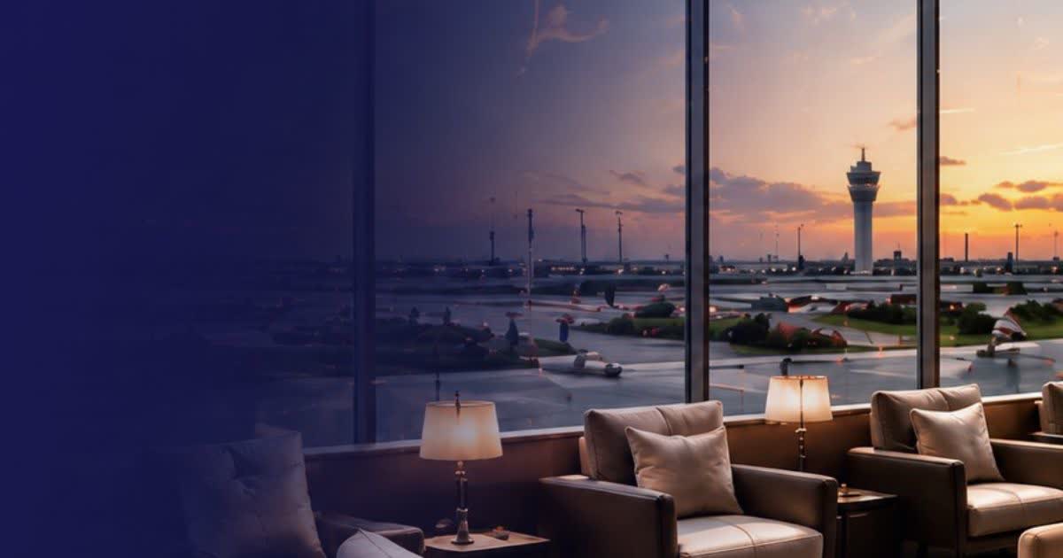 Departure lounge with view of planes at dusk
