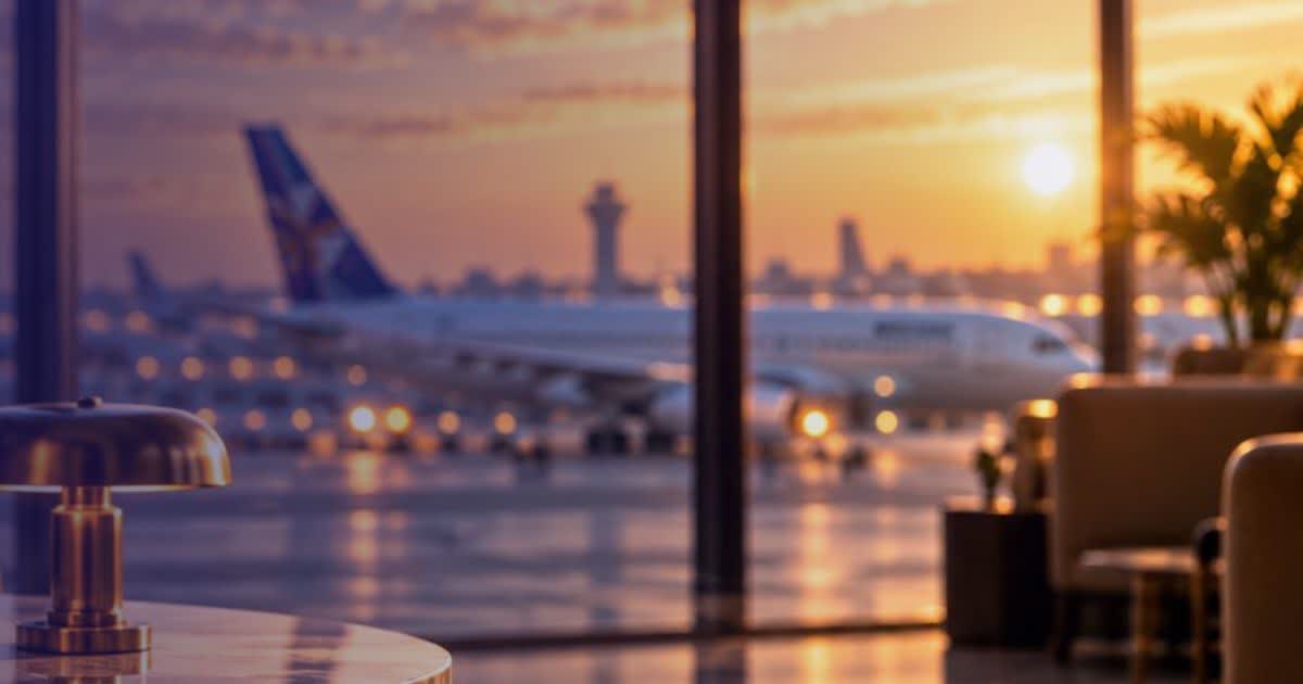Airport lounge with view of aircraft at sunset