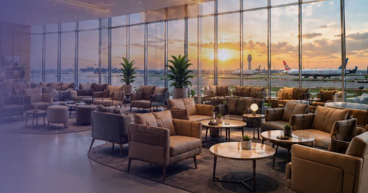 Quiet airport lounge interior with armchairs and large windows